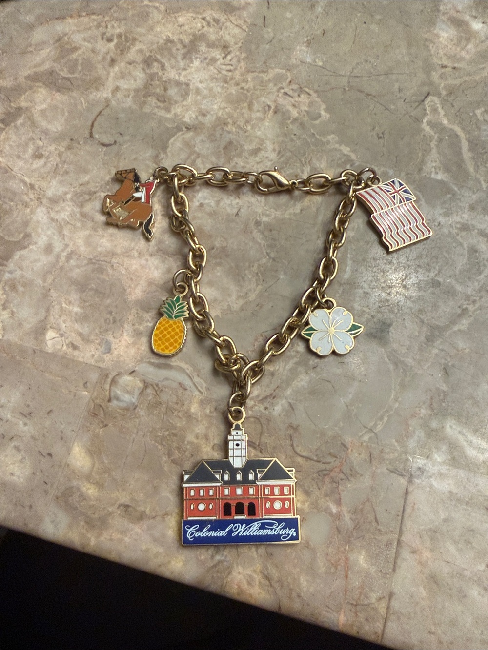 Gold tone enamel,  colonial Williamsburg charm bracelet